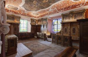 an ornate room with a ceiling and wooden furniture at AndersOrt Haus der Frauen in Buchberg bei Herberstein +39 photos