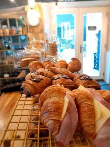 a display of croissants and other pastries on a table at Cotswold Gardens Bed and Breakfast in Stow on the Wold