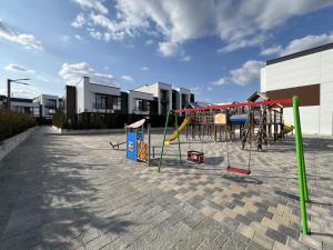 a group of playground equipment in a parking lot at Cruds Arena Chisinau in Chişinău