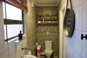 a small bathroom with a toilet and a sink at Blue Sky Retreat in Vredenburg +45 photos