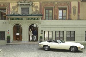 a white car parked in front of a building at Hotel des Balances in Lucerne +104 photos