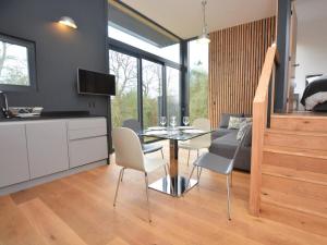 a kitchen and dining room with a glass table and chairs at 2 Bed in Brecon oc-59733 in Talgarth