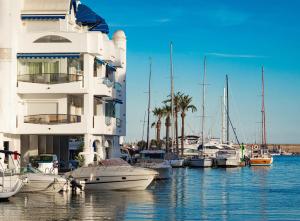 a group of boats docked in a marina at Villa puerto marina beach in Benalmádena