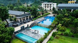 an overhead view of a pool in a resort at Siddhartha Riverside Resort, Chumlingtar in Makaising +19 photos