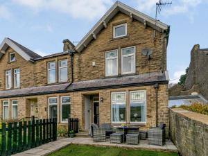 an exterior view of a brick house with windows at 4 Bed in Holmfirth oc-86032 in Holmfirth