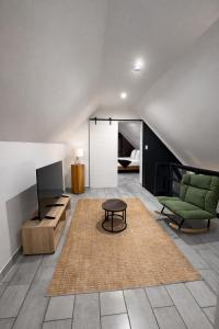 a living room with a couch and a table at 6 On Santorini in Langebaan