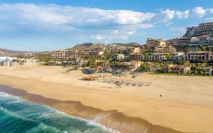 an aerial view of a beach with chairs and condos at Pueblo Bonito Sunset Beach Owners Studio Suite, REQUEST DATES see by Clay & Lisa in Cabo San Lucas +43 photos