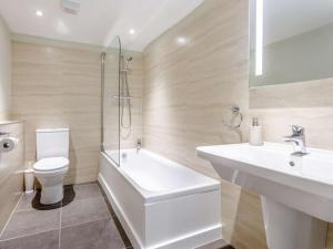 a bathroom with a sink and a toilet and a shower at 2 Bed in Taunton oc-blafa in Oake +13 photos