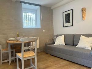 a living room with a couch and a table at ALAIA Mundaka in Mundaka +4 photos