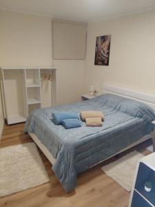 a bedroom with a large bed with two pillows on it at Refugio de Moncorvo in Torre de Moncorvo