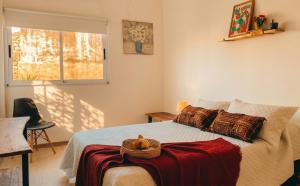 a bedroom with a bed with a teddy bear on it at Departamentos A&B in Resistencia
