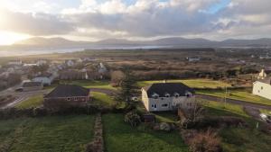 an aerial view of a village with a house at Waterville Links in Waterville