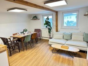 a living room with a couch and a table at Altstadt Appartement in Ingolstadt