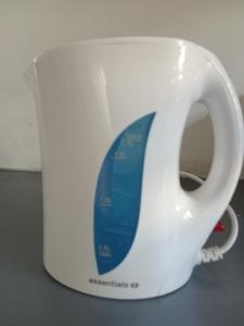 a white coffee cup with a bluevisor on it at Mamela BNB in Elandsfontein