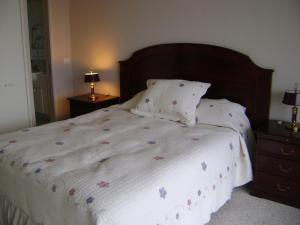Llit o llits en una habitació de San Alfonso Apartment