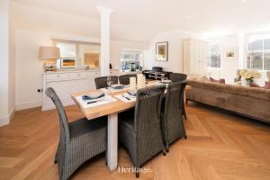 a kitchen and dining room with a table and chairs at The Old Sorting Office, Aboyne, Royal Deeside in Aberdeen