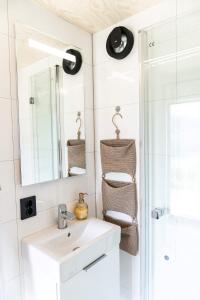 a bathroom with a sink and a mirror at Cabin in the orchard in Sandane