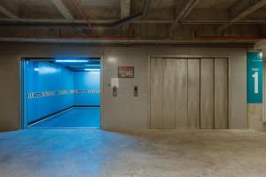 an empty room with a door and a garage at Cozy Loft in Class 48 in Sabaneta