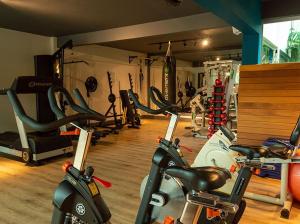a gym with several exercise bikes in a room at Hotel Vila Verde in Nova Friburgo