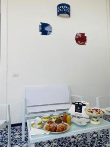 a table with plates of food on top of it at Dolce Pausa in Atrani