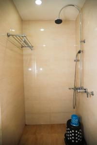 a shower in a room with a shower at Hotel Center Point in Bhubaneshwar +11 photos