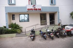 a group of motorcycles parked in front of a building at Hotel Center Point in Bhubaneshwar