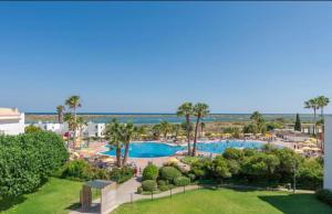 an aerial view of a resort with a swimming pool at Cabana da Ria in Cabanas de Tavira