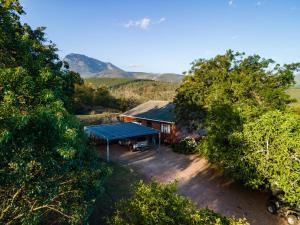 an overhead view of a house with a blue roof at Summer Villa in Mossel Bay