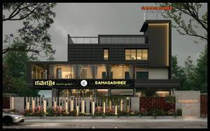 a large black building with a sign on it at Gamagashree Hotel and Fine Dine in Sāgar