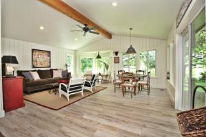 a living room with a table and chairs at Frog Cottage on the Blanco in Wimberley