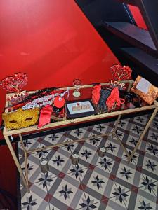 a table with a tray of food on top of a floor at L'instant Désir love room jacuzzi in Ferrières