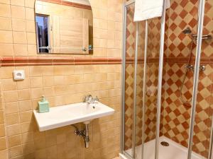 a bathroom with a sink and a shower at Sommeliérka - ubytování & vinný sklep in Valtice +32 photos