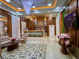 a hotel lobby with a reception desk and a waiting room at ART REGENCY Premium Hotel in Tashkent