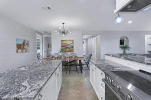 a kitchen and dining room with a dining table at Gatlin Getaway in Dripping Springs