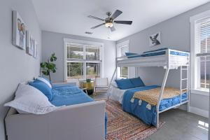 a bedroom with a bunk bed and a couch at Gatlin Getaway in Dripping Springs +27 photos