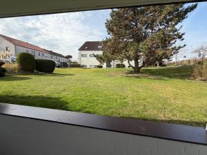 a view of a yard from a window of a house at Apartment Alex in Hildesheim