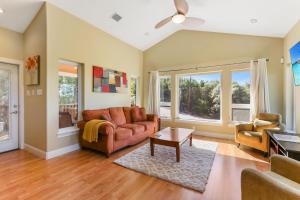 a living room with a couch and a table at Green Roof Cottage in Canyon Lake