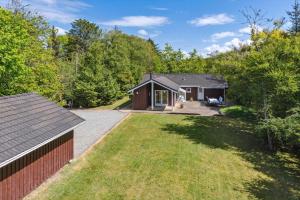 an aerial view of a house with a yard at BL1163-Blokhus-Raappenmark-2 in Blokhus