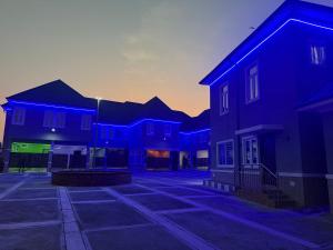 a group of houses in a parking lot at Unique CityLife Hotel in Etoi