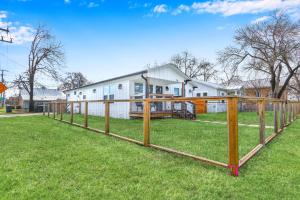 a wooden fence in front of a house at Bridge Haus in New Braunfels