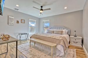 a bedroom with a bed and a ceiling fan at Bridge Haus in New Braunfels