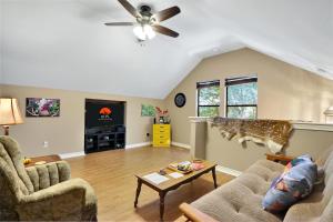 a living room with a cow statue on the wall at Happy Hideaway in Wimberley