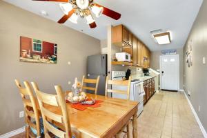 a kitchen and dining room with a table and chairs at Happy Hideaway in Wimberley