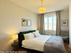 a bedroom with a large bed and a window at Saverio & Daria Aprtements by Mamo Florence in Florence