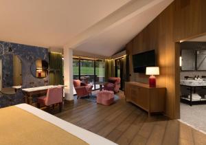 a hotel room with a bed and a living room at JA Mar Hall Glasgow Scotland in Bishopton +62 photos