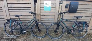 two bikes parked next to each other in front of a building at MoonLight Noszvaj in Noszvaj