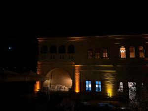 a night view of a building with lights on at Hush Cappadocia Hotel in Ürgüp