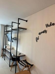 a room with a bunk bed and a desk at Apartamento Dein Haus in Pomerode +7 photos