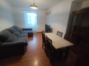 a living room with a couch and a table at Mouraria in Elvas