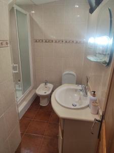 a bathroom with a sink and a toilet at Mouraria in Elvas